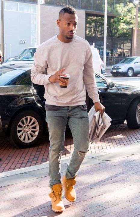 Outfit: Grey crewneck sweatshirt, Ripped distressed jeans, Wheat leather boots, Paper coffee cup