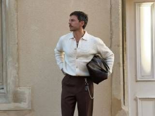 Outfit: Cream knit polo cardigan, Brown pleated trousers, Dark brown leather tote bag, Silver wallet chain