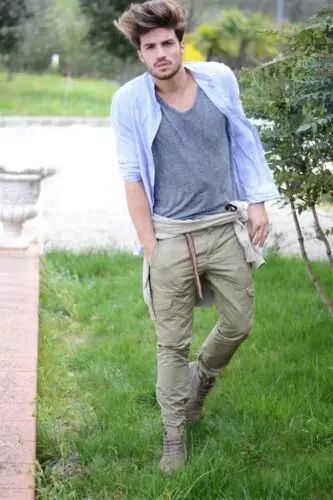 Outfit: Light blue linen shirt, Grey V-neck t-shirt, Olive green cargo pants, Beige shirt tied around waist